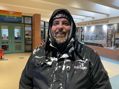 School custodian covered in snow and ice